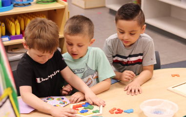 Children playing with puzzle