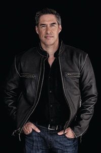 author Brad Taylor in black shirt and leather jacket with blue jeans