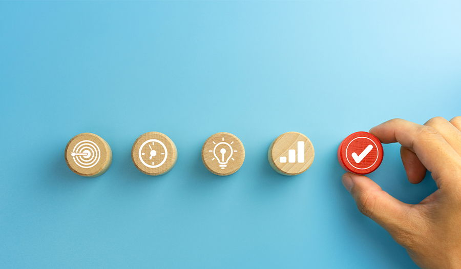 Businessman plan a project with wooden cubes with icon business strategy on blue background