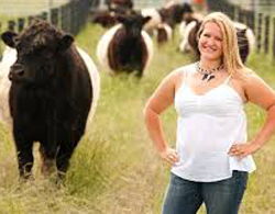 Red Barn Meats woman standing with cows