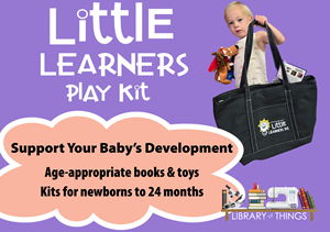 Little Learners Play Kit Child holding up black branded JCPL bag with items in Little Learners Play Kit