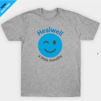 grey t-shirt with blue winky face that says Healwell a little mouthy