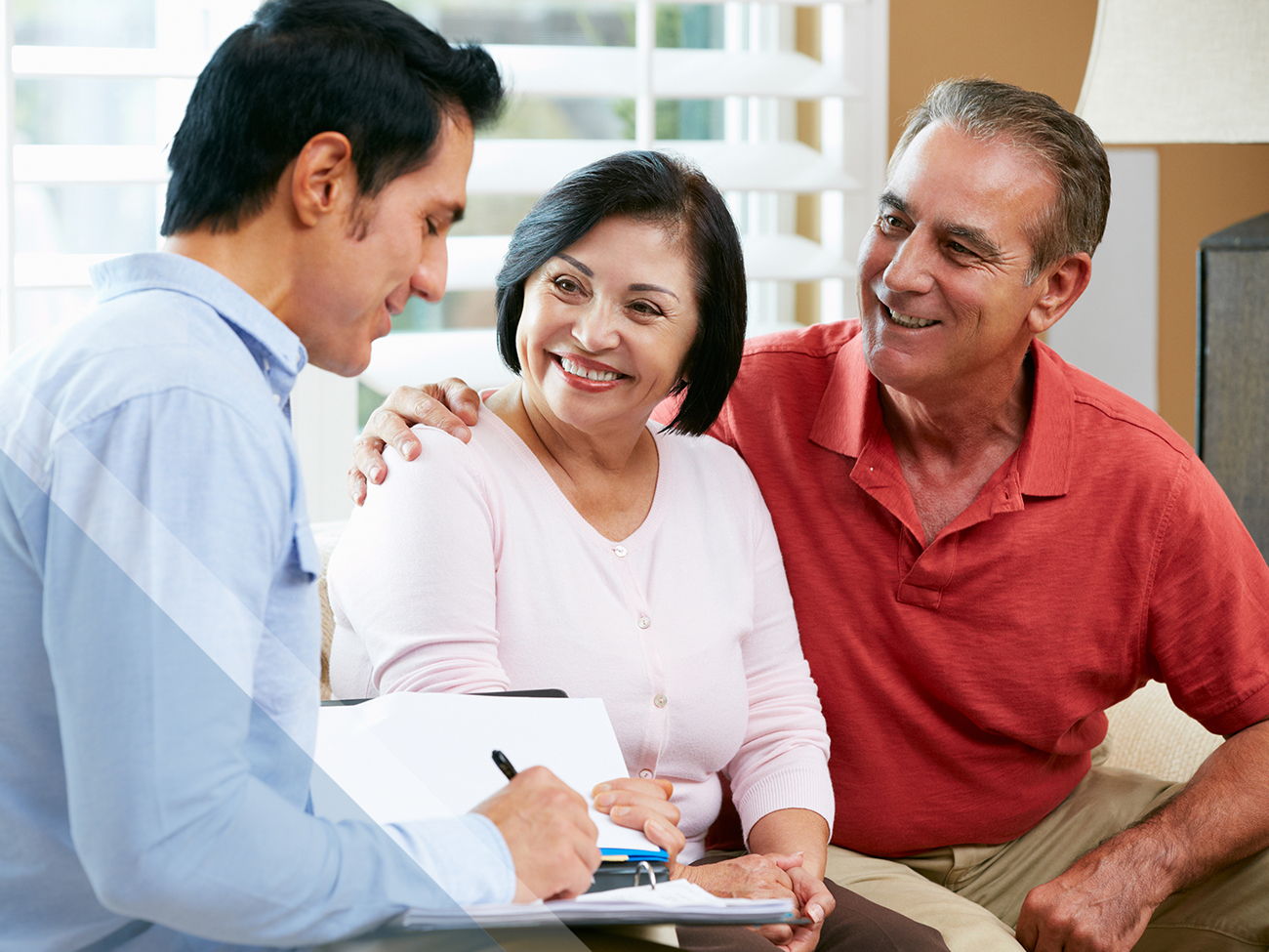 Hispanic couple meeting with advisor