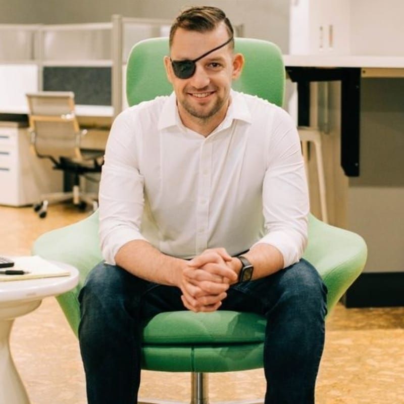 erik sitting in green chair