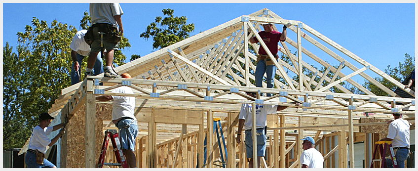 volunteer volunteers building a house
