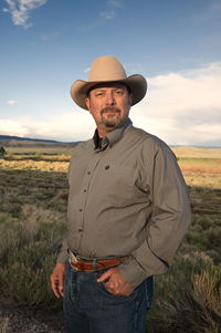 Author C.J. Box cowboy hat on plains