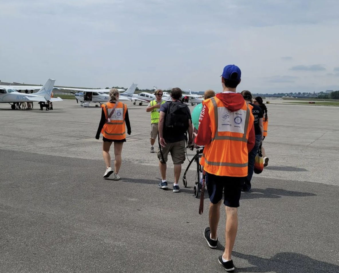 Epsilon Phi brothers on the tarmac