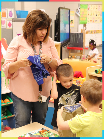 Childcare teacher playing with kids