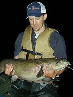 Fish Community Assessments guy holding a fish image Fish Community Assessments guy holding a fish image