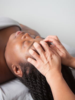 woman receiving head massage