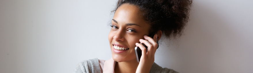 Smiling woman making a phone call