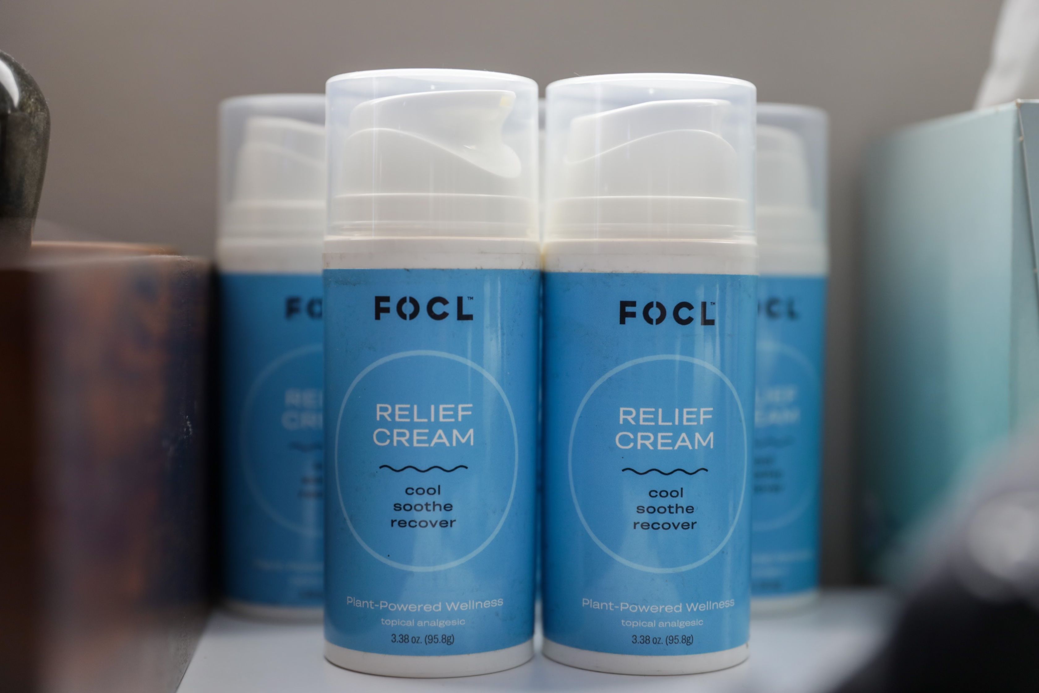 Several blue bottles of FOCL relief cream