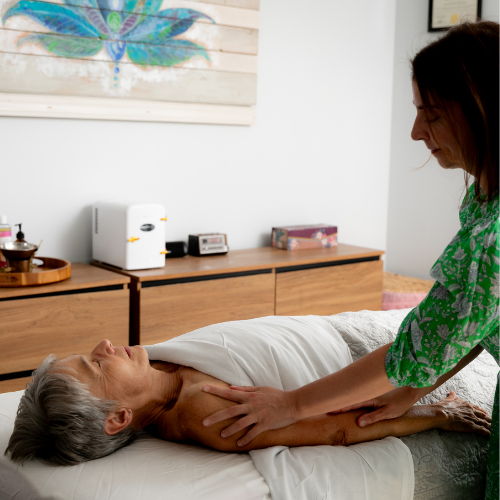 Lymphatic Drainage Body Treatment jackie massaging client's arm
