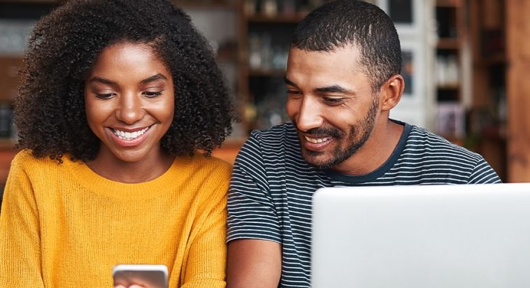 dad and daughter doing digital banking