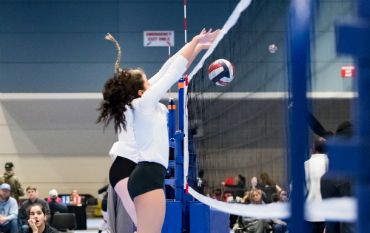 2 girls on the 18's team blocking a ball