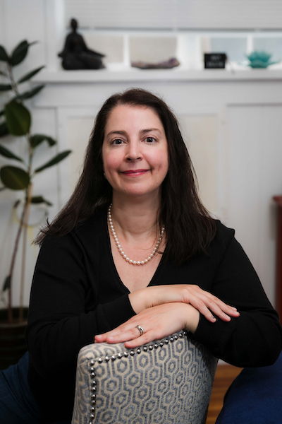 Jackie Lunato white woman with black hair smiling