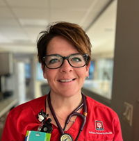 Emily Grindstaff in red shirt with stethoscope