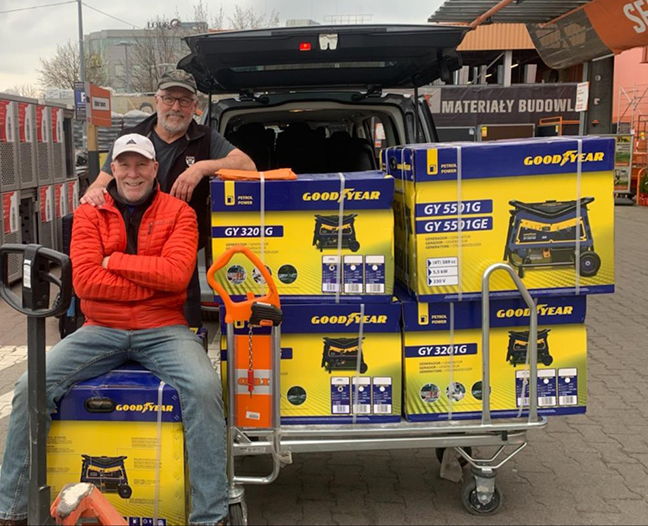 GENERATING HOPE: URI alumni and Theta Chi fraternity brothers Jim Buehler, front, and Lorne Adrain, pause before loading generators into a van to assist Ukrainians as they fight to defend their country and millions flee their war-torn country. Photos courtesy of Jim Buehler and Lorne Adrain.