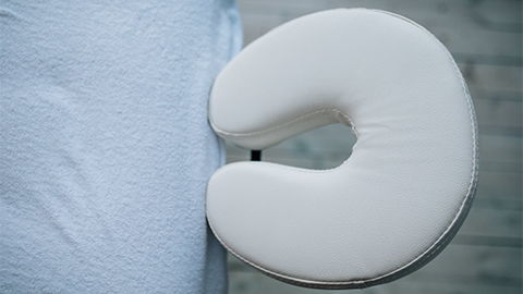 massage table headrest with white cover