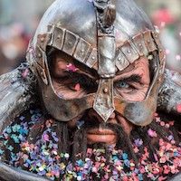man in viking helmet covered in confetti