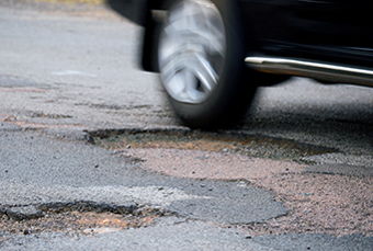 Image for Auto Insurance and . . . Pothole Damage?