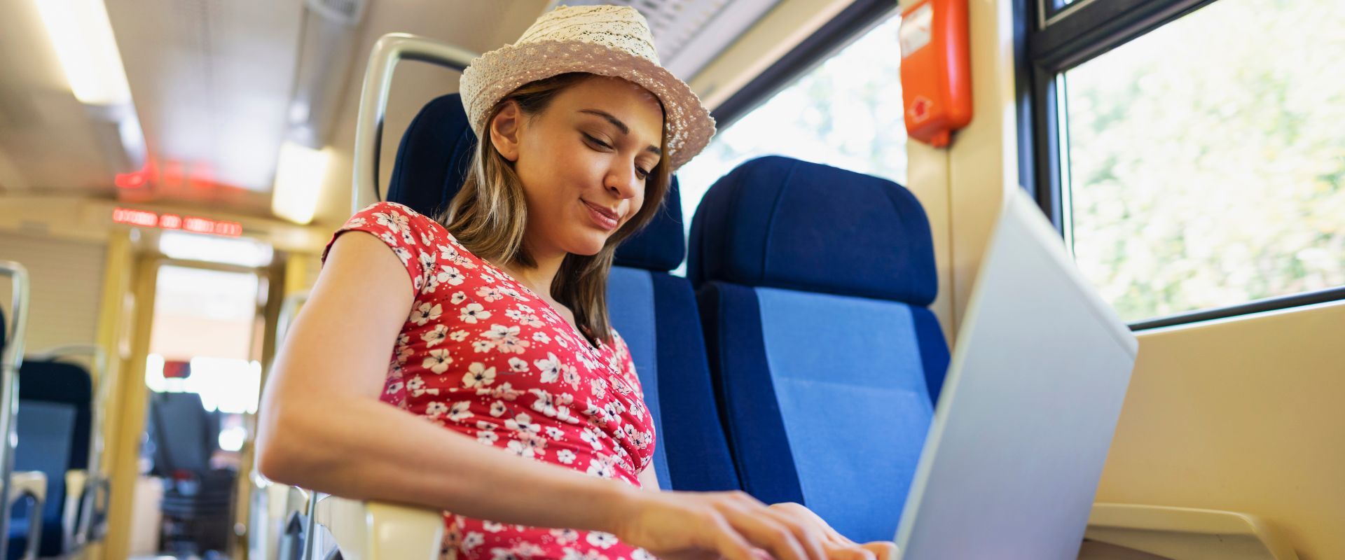 U.S. expat on a train researches what citiship-based taxation on her laptop.