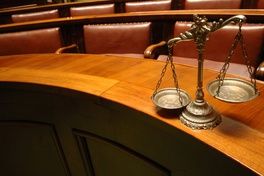 scales of justice on table