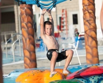 boy playing at water park freedom springs