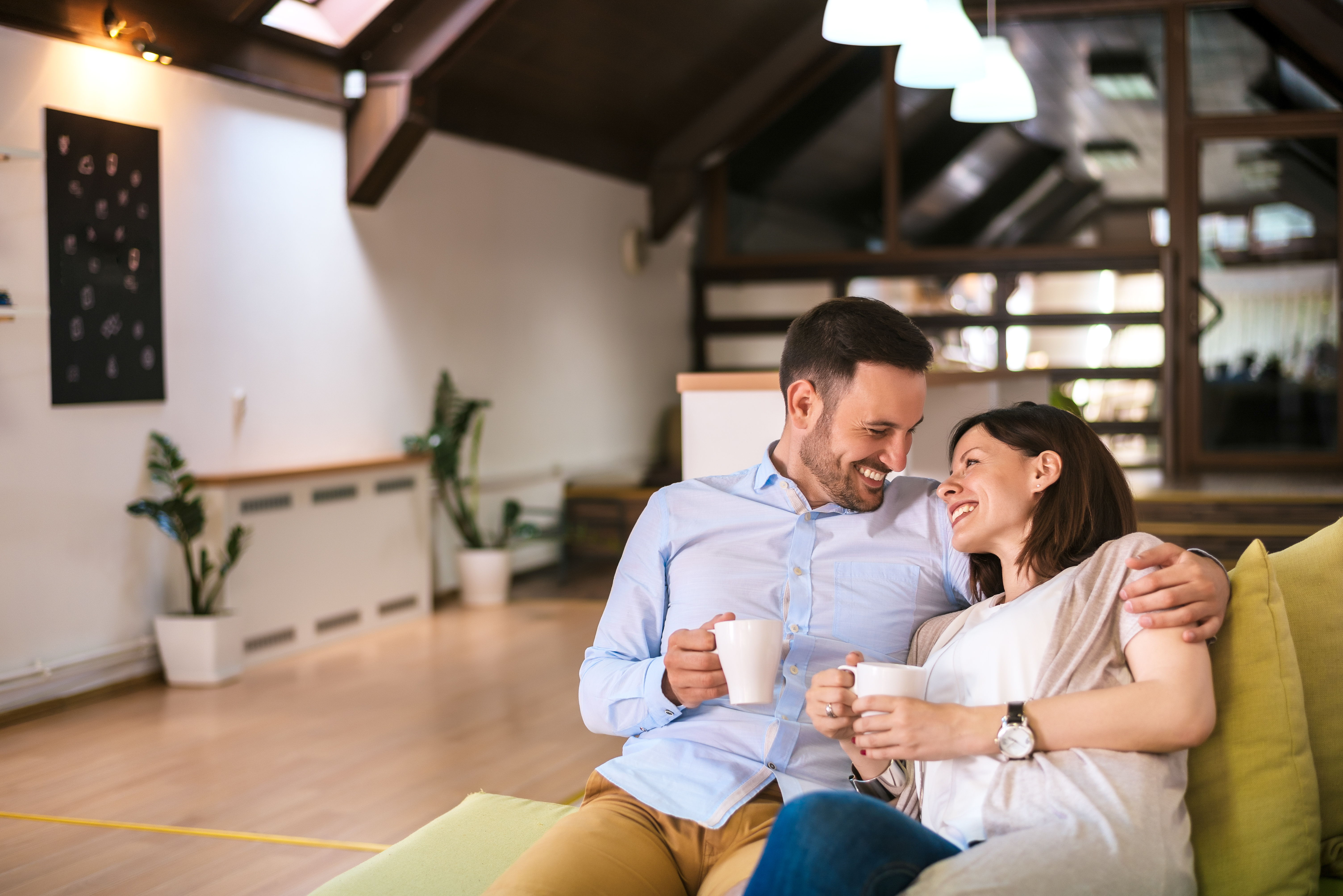 couple-drinking-coffee-living-room