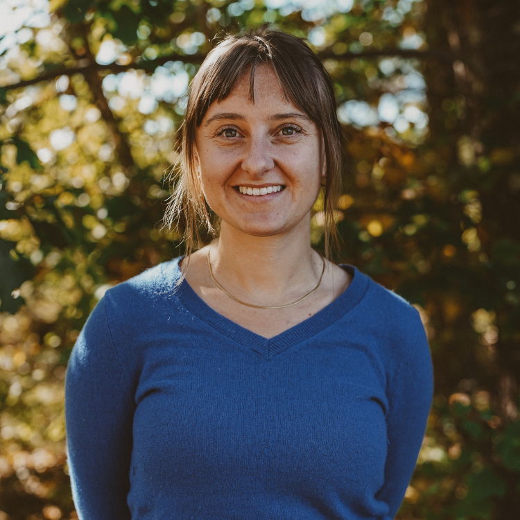 Young woman with blue shirt, smiling
