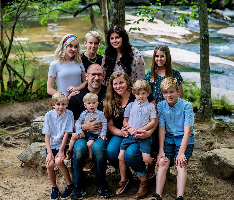 david and his family sitting in nature