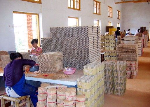 Image of people working on products in a factory