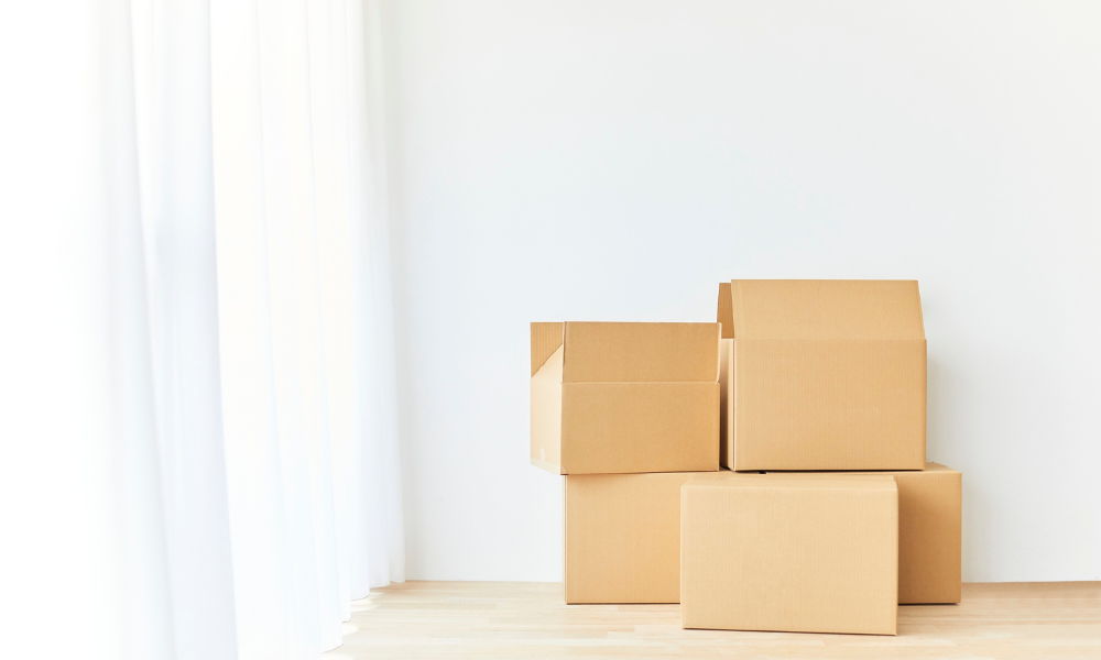 moving boxes moving boxes up against a white wall