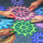 Child hands drawing gears with sidewalk chalk Child hands drawing gears with sidewalk chalk