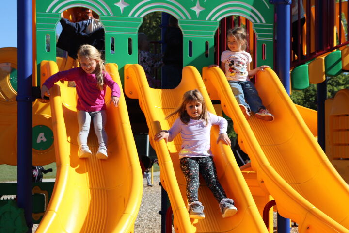 Children going down slide