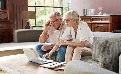elderly couple on couch Gaining full control of their money