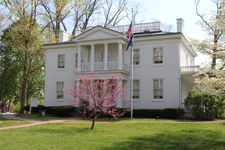 Lane place historical estate white building with bright green lawn