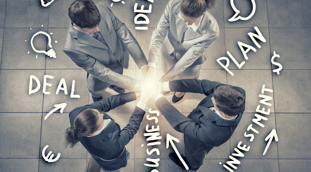 Top view of business people with hands in stack