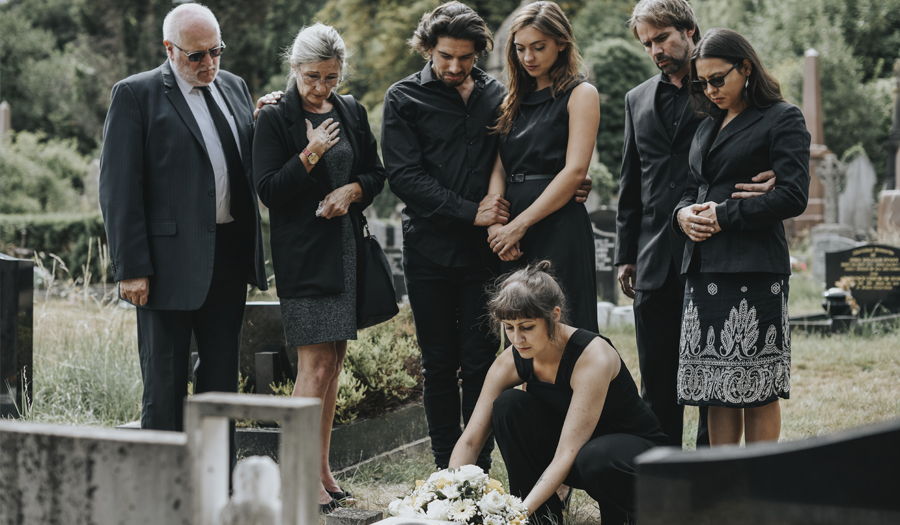 family grieving at funeral