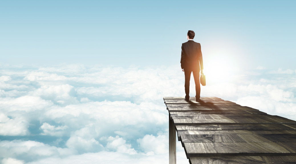 businessman standing on pier an looking on city