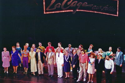 Company members of the 1994 production of LA CAGE AUX FOLLES takes a bow. Jeff Newkirk played Francis, the stage manager, seen here in the red polo in the front line.
