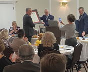 Sen. Goode presents Norman Lowery with Sagamore of the Wabash