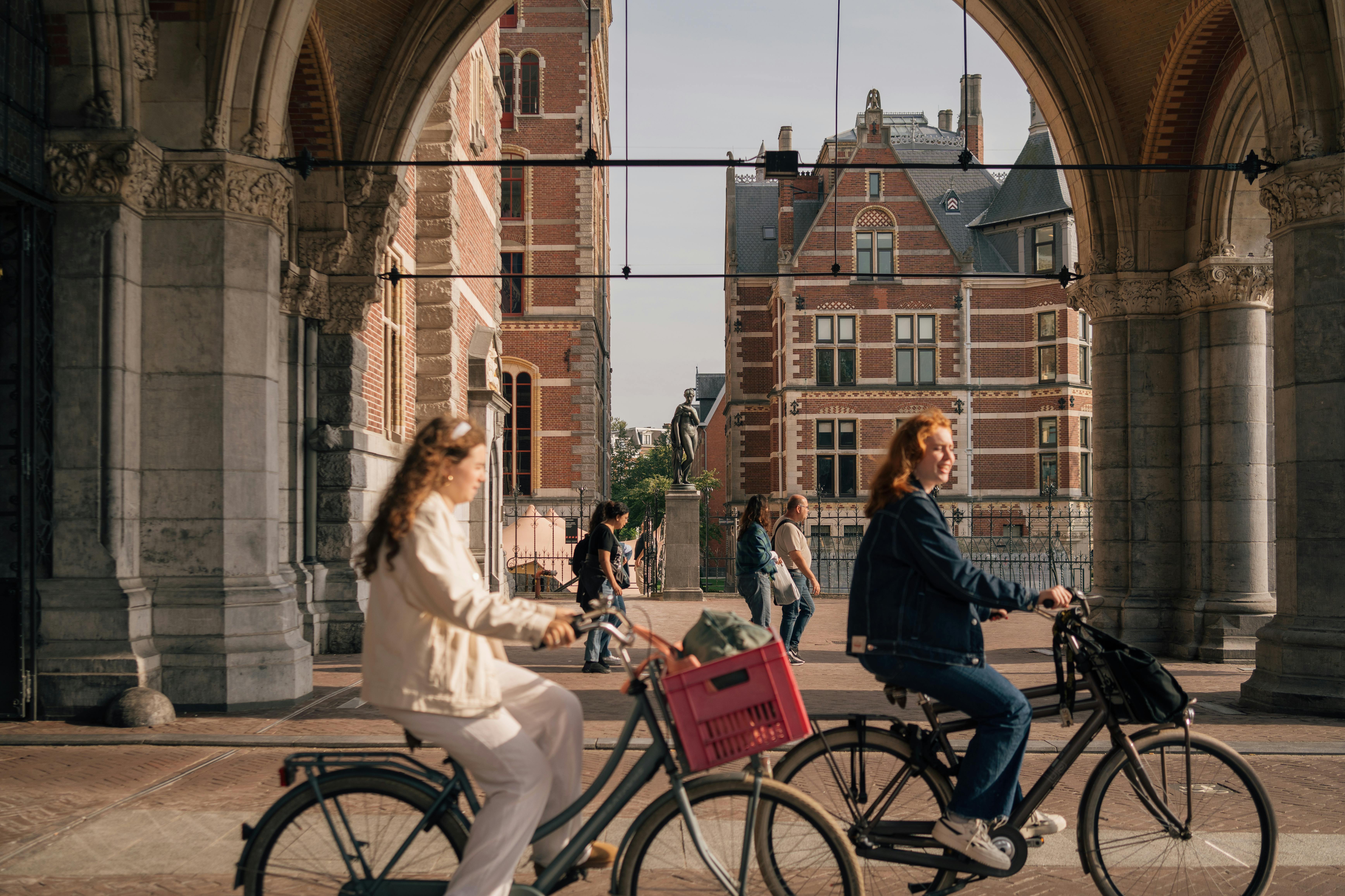 Two women riding bikes in the Netherlands