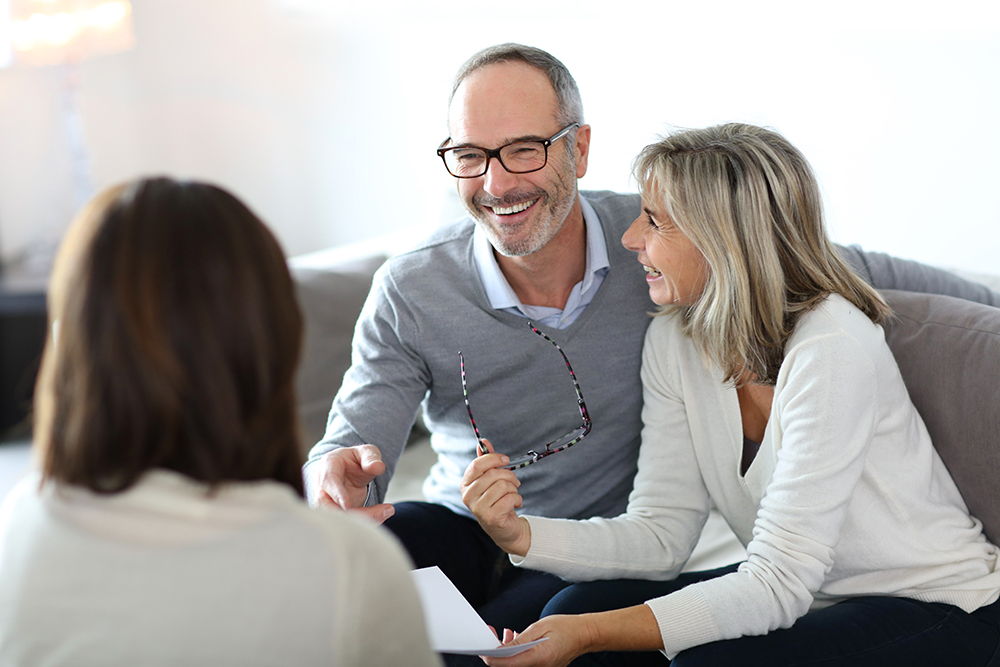 husband and wife meeting with lawyer