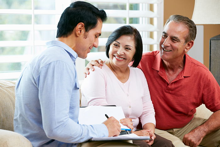 Hispanic couple with advisor