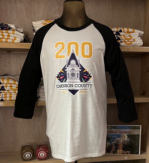 Bicentennial Quest prizes, t-shirt with candles and a book