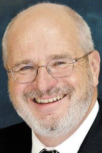 John Krull John Krull in black suit with white shirt in glasses
