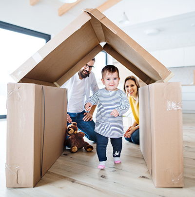 Family Playing with Boxes Family Playing with Boxes Shaped Like House