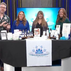 aqua serene wellness 4 people standing behind display table