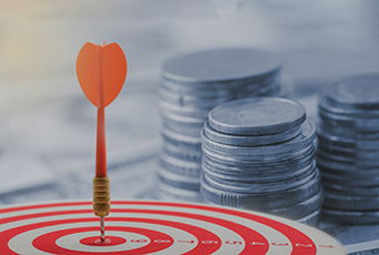 Target-Date Funds Picture of Stacks of money next to an arrow hitting the bullseye of a target.